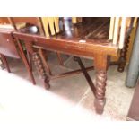 A 1920s oak drawer leaf table and four non matching chairs.