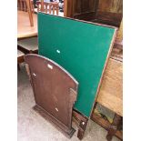 A green baize top folding card table and a wooden fire screen.