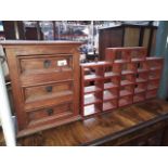 An eastern miniature chest of drawers and a spice rack.