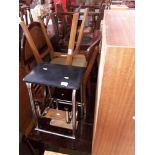 A Remploy drop leaf table and four chairs, an open bookcase and a retro fold out step stool.