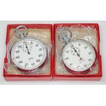 Two Smiths stopwatches, each with an Omega box.