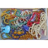 A box of mainly vintage beads including lapis lazuli, coral, bone, ivory etc.