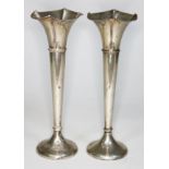 A pair of hallmarked silver vases, height 20.5cm.