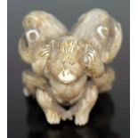 A Japanese carved ivory netsuke depicting The Three Wise Monkeys, signed Masatomo, height 32mm.