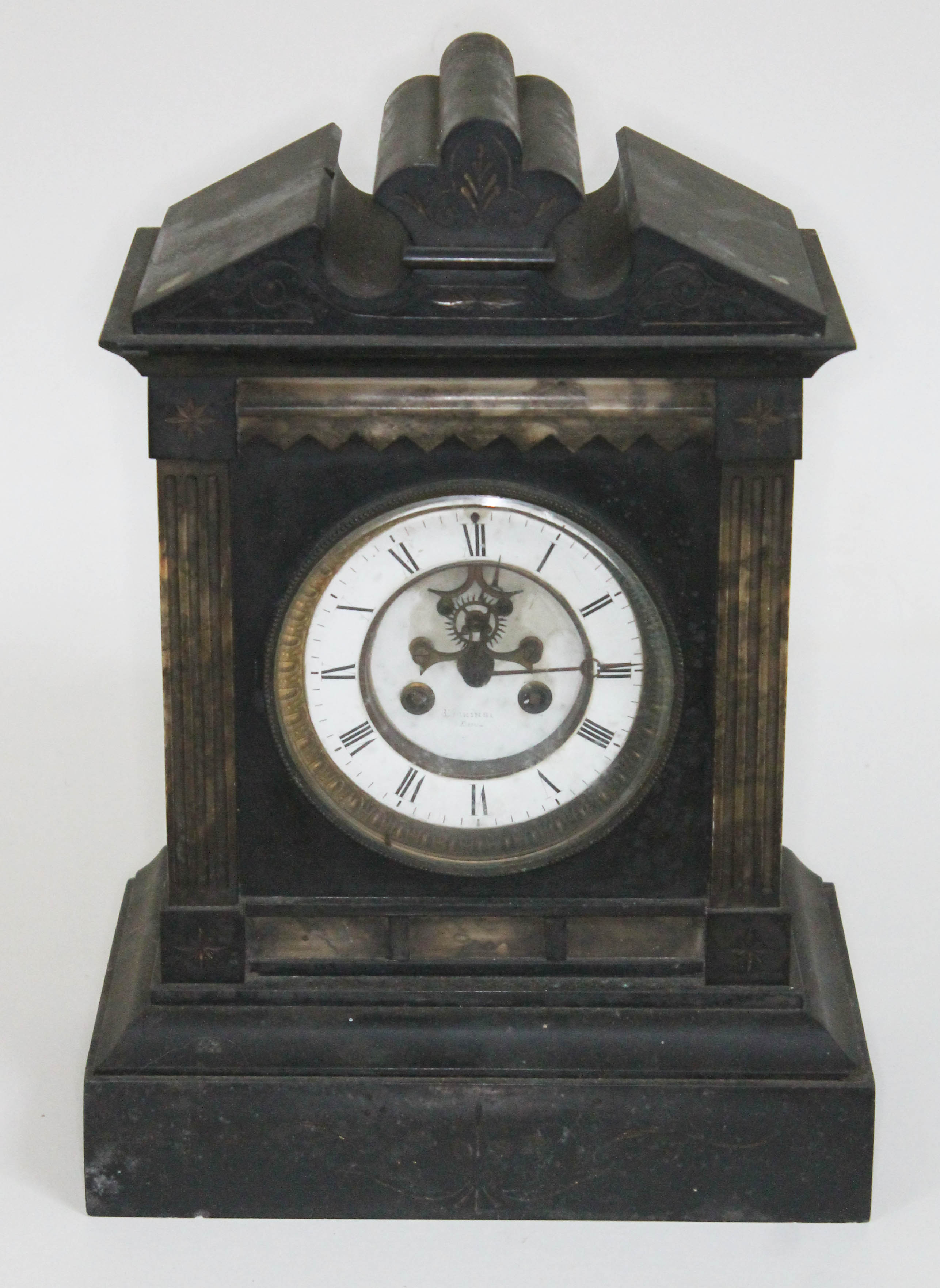 A late 19th century black slate and marble architectural mantel clock with visible brocot