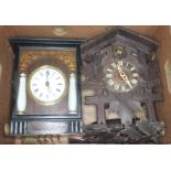 A Black Forest cuckoo clock and a continental wall clock.