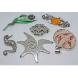 Five assorted brooches and a pendant, white metal and marked 925.