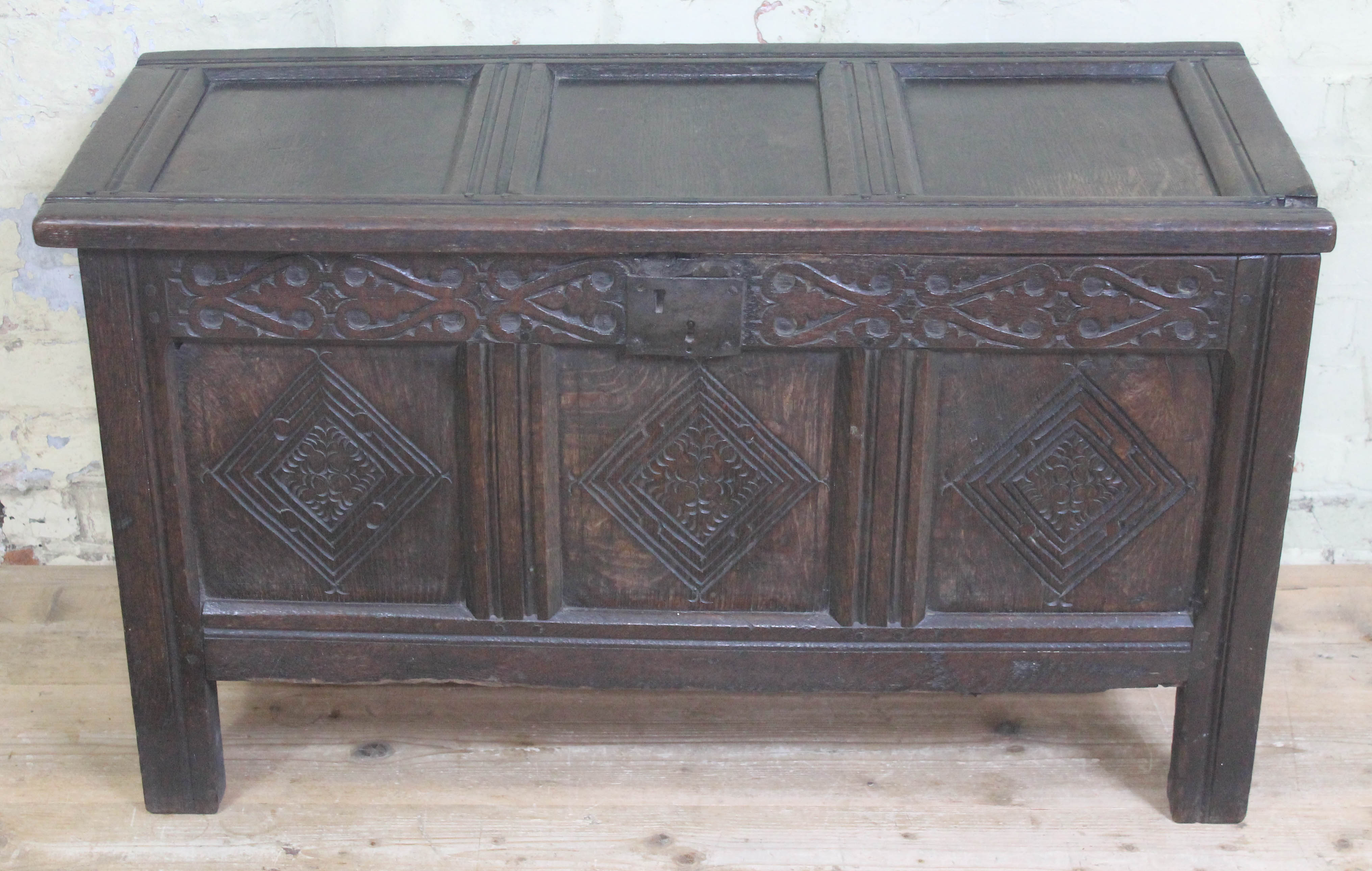 A 17th century carved and panelled joined oak coffer, length 107.5cm, depth 45cm & height 62cm. - Image 2 of 11