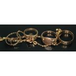 A group of four hallmarked 9ct gold rings together with a 9ct gold mounted elephant hair necklace,