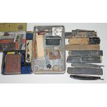 A tin and contents including nine cut throat razors, foreign silver coins etc.