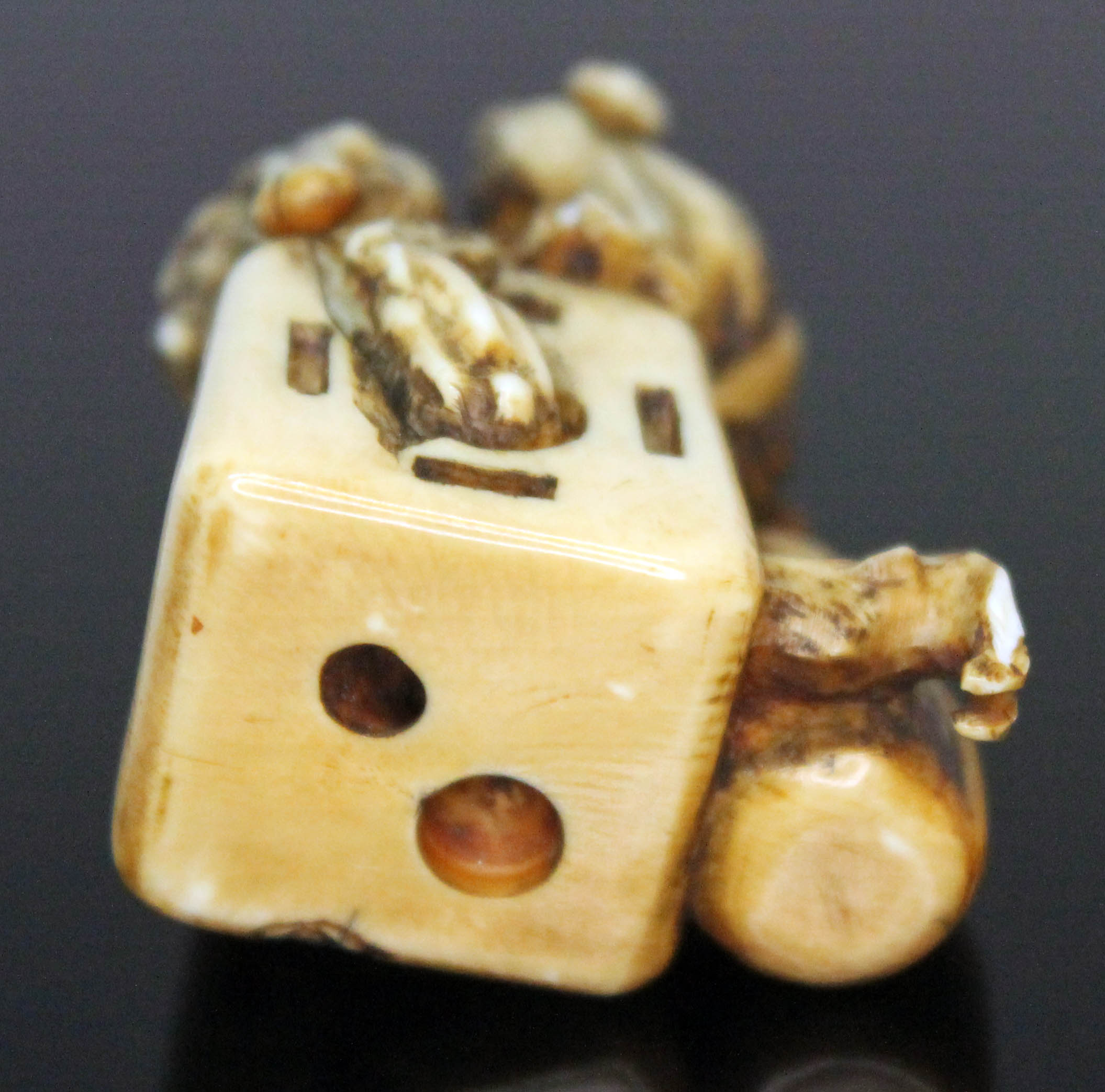 A Japanese carved ivory netsuke formed as an oni catcher on top of a box with protruding limbs, - Image 3 of 8