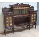 An Edwardian Art Nouveau mahogany cabinet of stepped form with broken scroll pediment, pierced