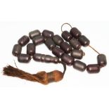 A cherry bakelite islamic prayer necklace formed from 20 barrel shaped beads approx. 17mm each and