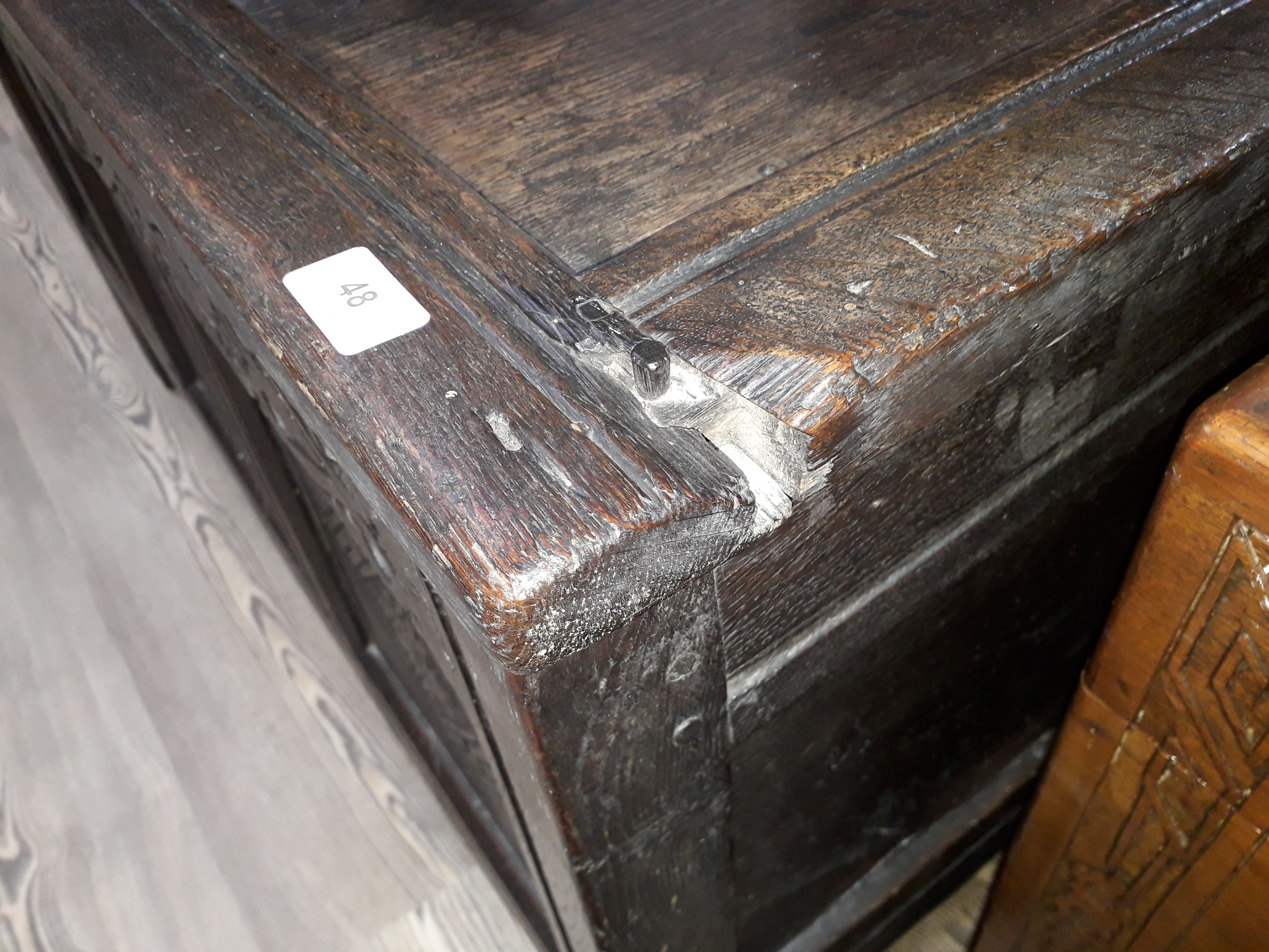 A 17th century carved and panelled joined oak coffer, length 107.5cm, depth 45cm & height 62cm. - Image 3 of 11