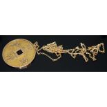 A Chinese pendant on chain, both marked 14K, pendant diam. 32mm, chain length 62cm, wt. 9.89g.