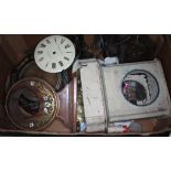 Three boxes of various clocks and clock parts.