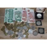 A quantity of coins and banknotes including a Malawi ten kwacha silver coin, banknotes, crowns etc.