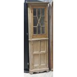 A 19th century slender pine corner cabinet, width 59cm, depth 43cm & height 205cm.