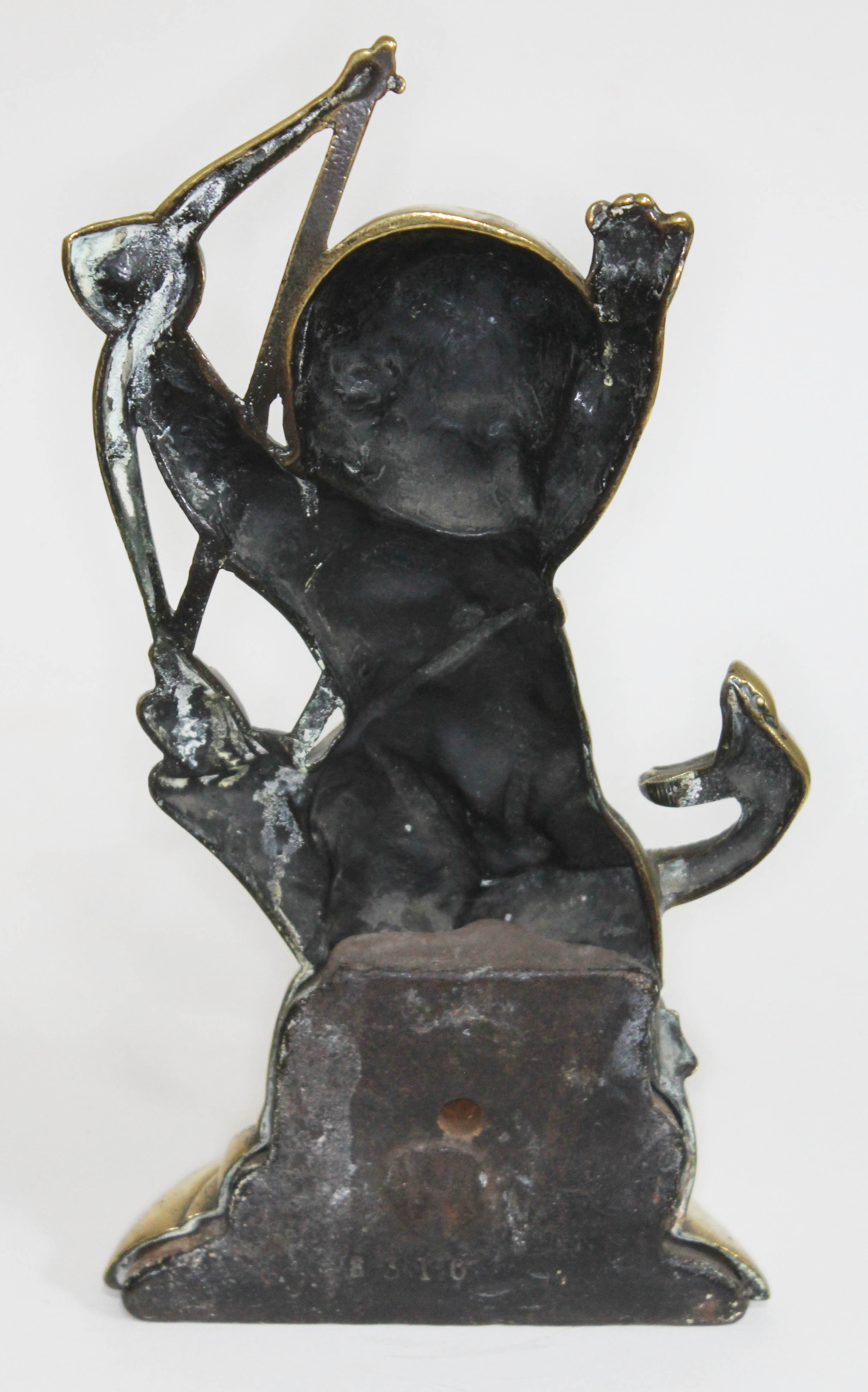 An early 19th century lead weight brass door stop formed as cupid fighting a serpent, number 8310, - Image 2 of 2