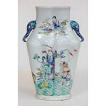 A Chinese porcelain vase with elephant mask handles and decorated with over enamels, bearing six