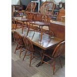 A Batheaston reproduction oak refectory table with eight ash and elm seated chairs comprising a