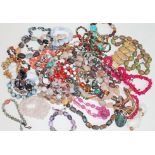 A mixed lot of vintage bead necklaces and bracelets including snowflake obsidian, various quartz