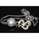 A diamond and cultured pearl drop pendant, unmarked, pendant length 32mm, chain marked PT950, length