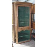 A 19th century pine corner cabinet, width 88cm, depth 63cm & height 208cm.