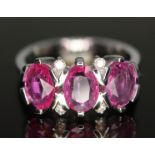 A pink sapphire and diamond cluster ring, gross sapphire wt. approx. 2.35ct, band marked 585,