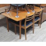 A McIntosh teak extending dining table matched with four G-Plan chairs.