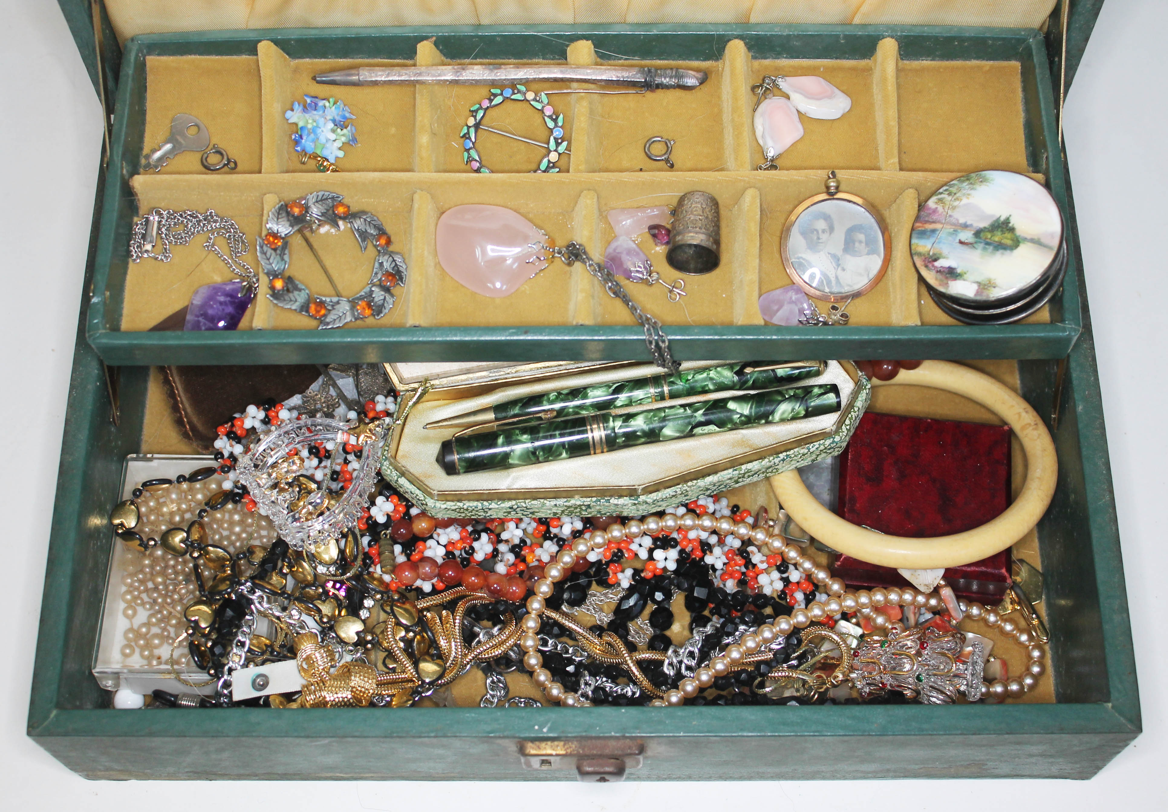 A mixed lot comprising mainly costume jewellery including beads, brooches etc. together with a