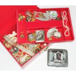 A box of costume jewellery including a a metal cigarette case decorated with a panel depicting