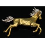 An equestrian brooch modelled as a galloping horse in textured 18ct gold with diamonds set in tail