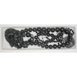 A jet bead necklace and bracelet, together with other similar beads.