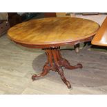 A Victorian walnut pedestal table.