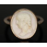 A shell cameo ring, setting and band in yellow metal, unmarked, gross wt. 2.82g, size N.