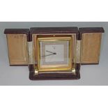 An Art Deco Zenith alarm clock in leather case, height 11.5cm.