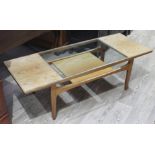 A G-Plan teak coffee table with glass insert and lower tier, length 137cm.