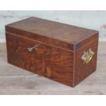 A pollard oak box with brass handles, length 31cm.