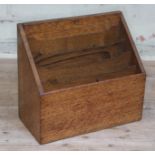 An oak stationary box with lift and slide top, length 30cm.