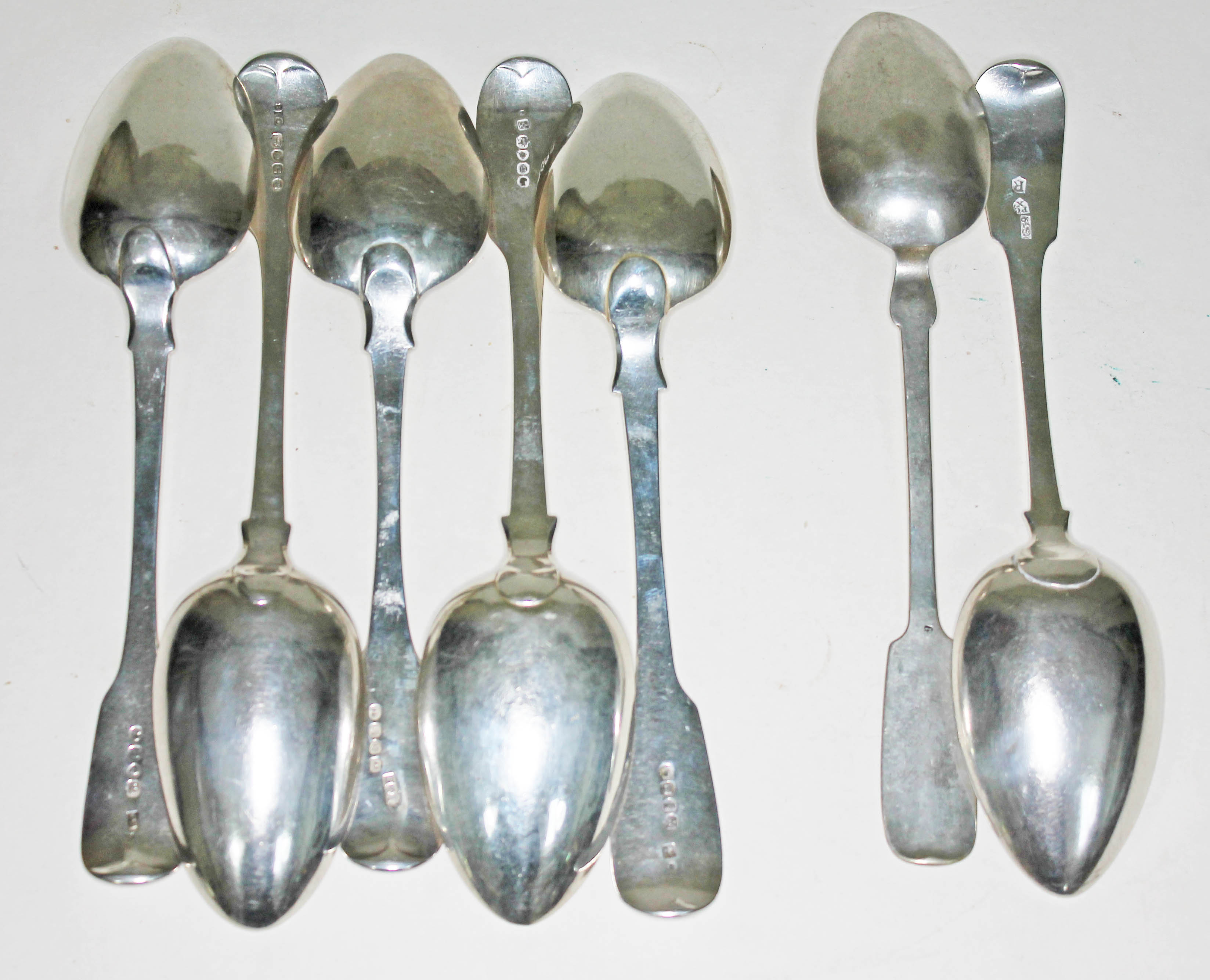 A matched set of five hallmarked silver spoons, Georgian and later, together with a foreign spoon