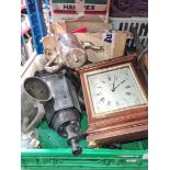 A box containing clocks, outdoor lights, metalware and double sockets etc.