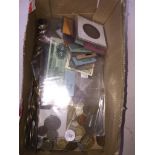 A box of world coins and banknotes