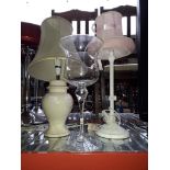 A glass vase and two table lamps.