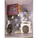 A box of world coins and banknotes