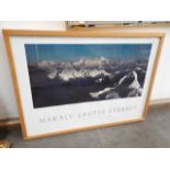A photographic print depicting mount Everest signed in pen by Doug Scott, glazed and framed 73cm x