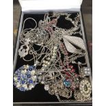 A box of costume jewellery including silver