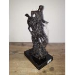 A modern bronze depicting a Native American riding a bucking horse on marble base, height 34cm.