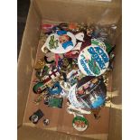 A box of 106 badges