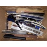 A box of pens and pencils.